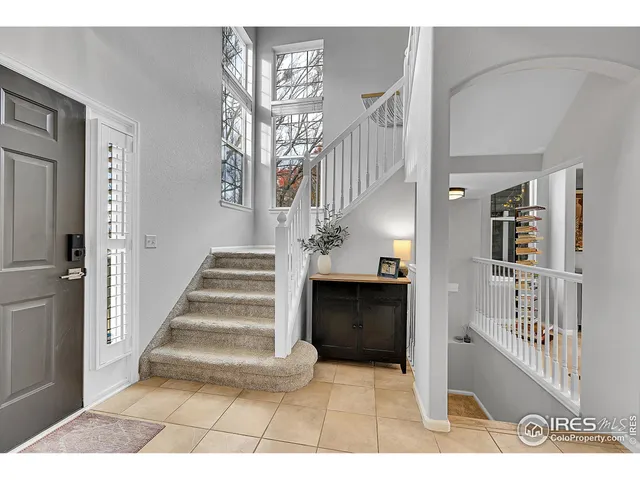 a spacious bathroom with a tub a double vanity sink and mirror