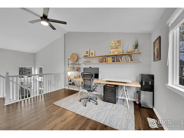 a bedroom with a bed and a tv