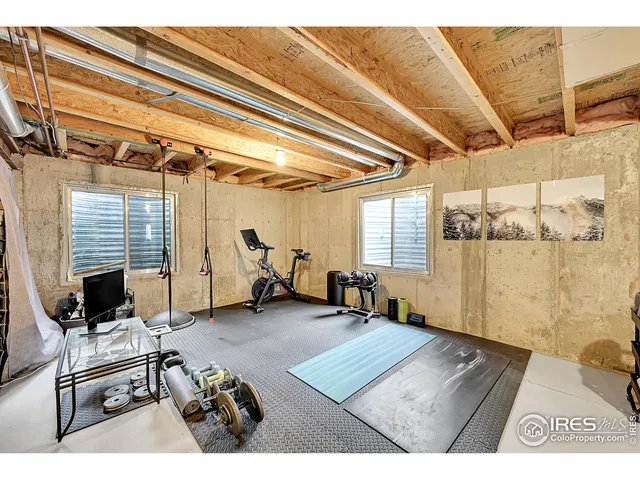 an aerial view of a house with a lake view