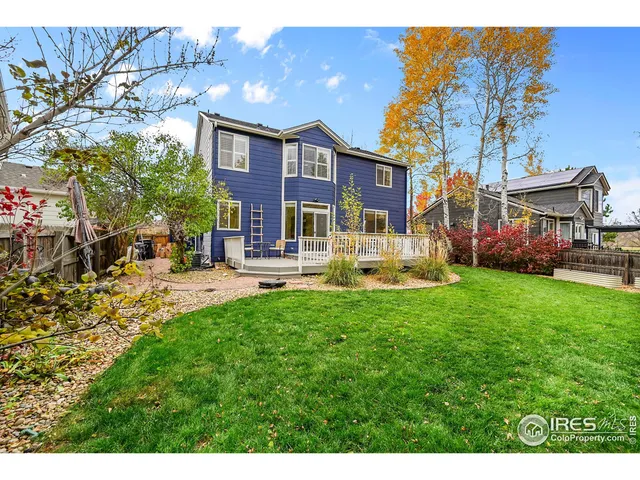 a view of outdoor space with a table and chairs