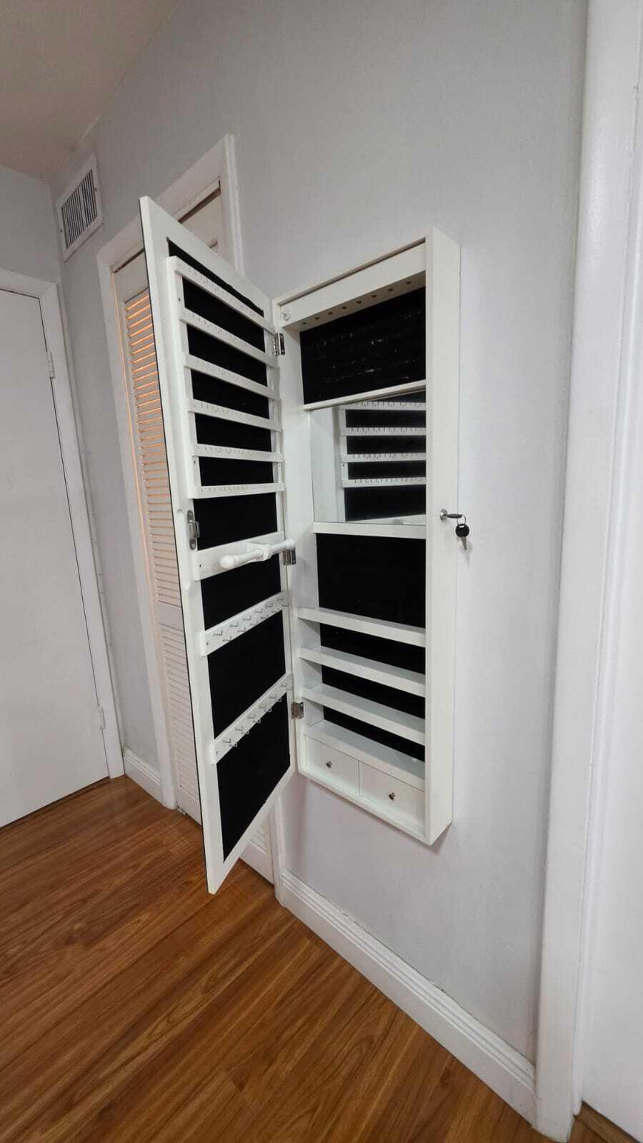 100 Ashbury Road, Unit 206 Hollywood, FL 33024 - Photo 20 of 23 a view of walk in closet with wooden floor