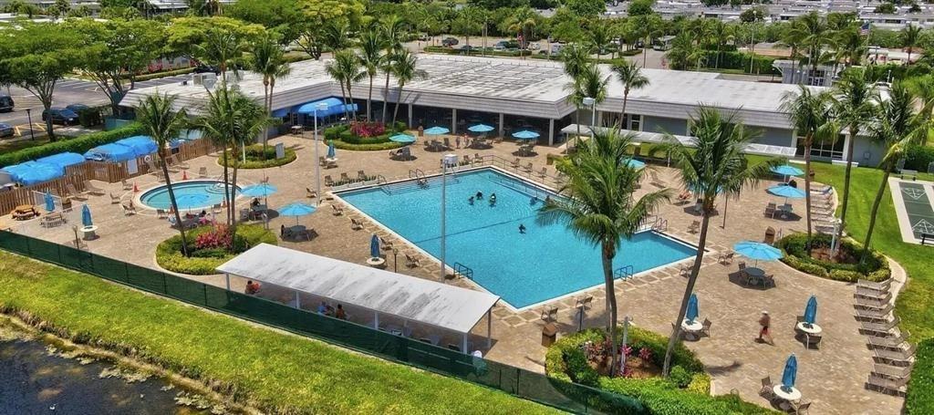 80 Valencia C, Unit D Delray Beach, FL 33446 - Photo 14 of 14 an aerial view of a house with garden space and street view