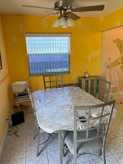 80 Valencia C, Unit D Delray Beach, FL 33446 - Photo 3 of 14 a balcony with table and chairs