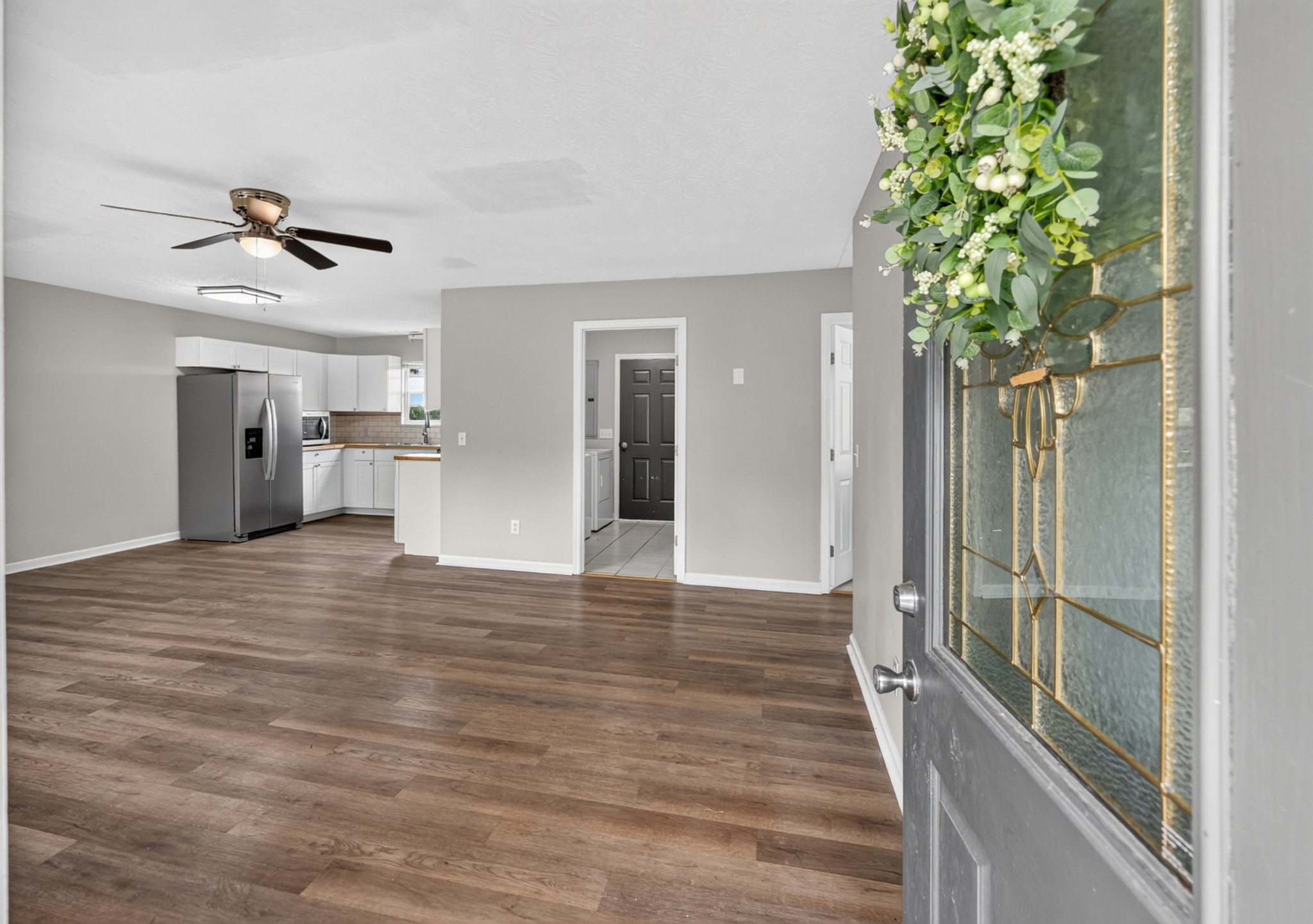 120 Driver Road Lafayette, TN 37083 - Photo 4 of 39 a view of a hallway with wooden floor and a potted plant