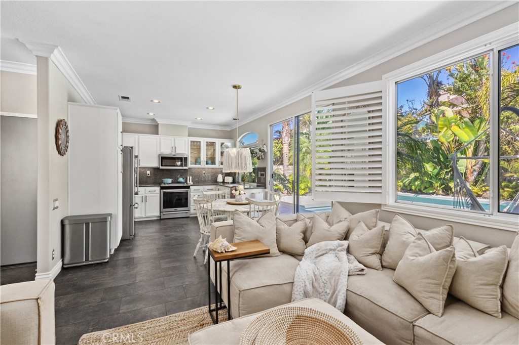 13668 Kingsbridge Street Westminster, CA 92683 - Photo 13 of 36 a living room with furniture and a large window