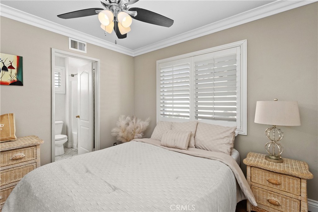 13668 Kingsbridge Street Westminster, CA 92683 - Photo 17 of 36 a bedroom with a bed and a window