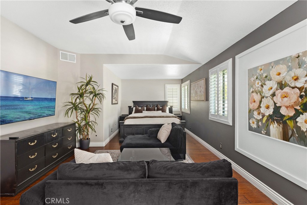 13668 Kingsbridge Street Westminster, CA 92683 - Photo 21 of 36 a living room with furniture and a flat screen tv