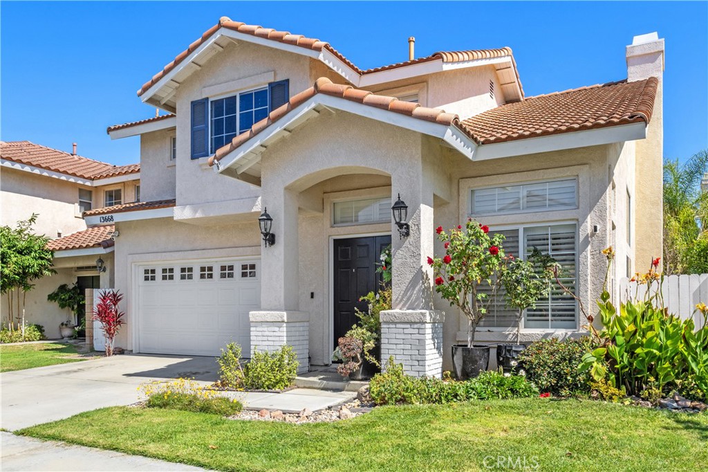 13668 Kingsbridge Street Westminster, CA 92683 - Photo 3 of 36 a front view of a house with a yard