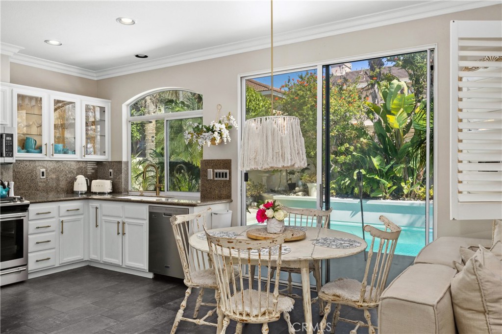 13668 Kingsbridge Street Westminster, CA 92683 - Photo 10 of 36 a view of a dining room with furniture window and outside view