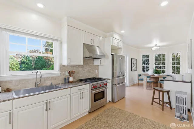 a bedroom with bed and a potted plant