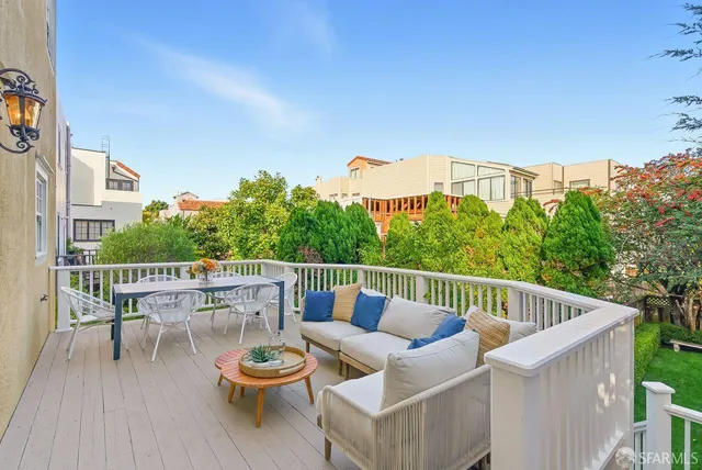 a bedroom with two beds and a couch