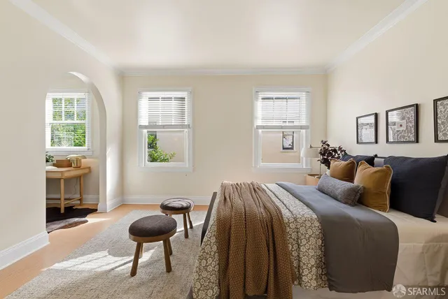 a utility room with dryer washer and a view of living room