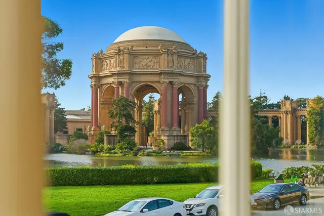 a view of a balcony with a floor to ceiling windows and wooden floor