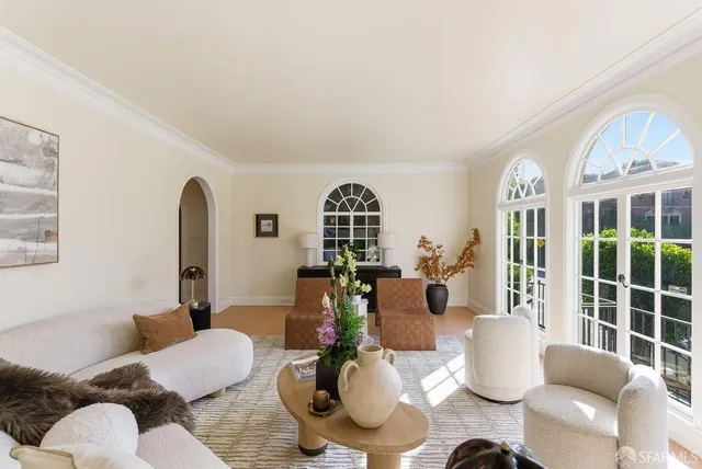 a kitchen with stainless steel appliances a stove a sink and cabinets