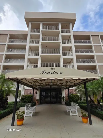a building outdoor space with a table and chairs