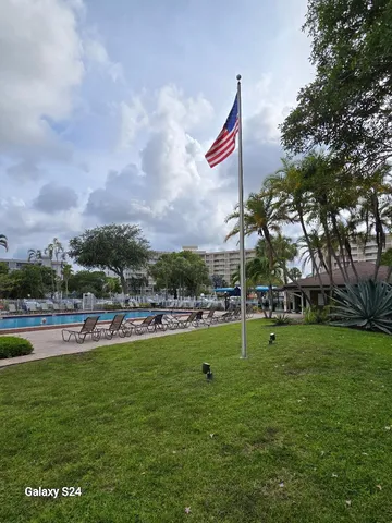 a view of a park with swings and slides