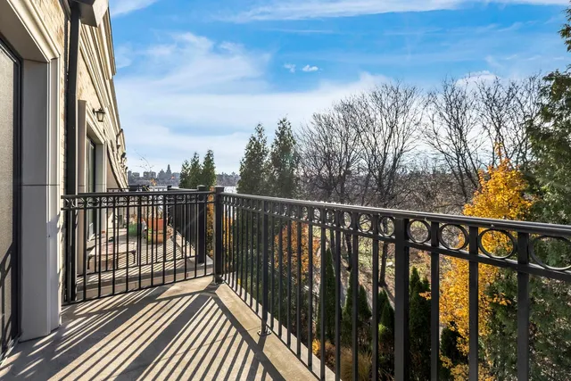 a view of balcony with wooden floor and fence
