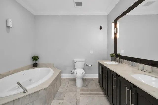 a bathroom with a sink a toilet and a bathtub