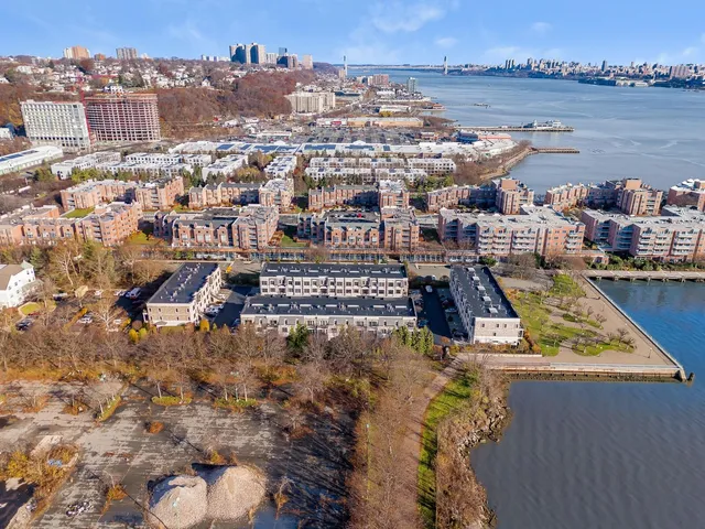 an aerial view of residential house with an ocean