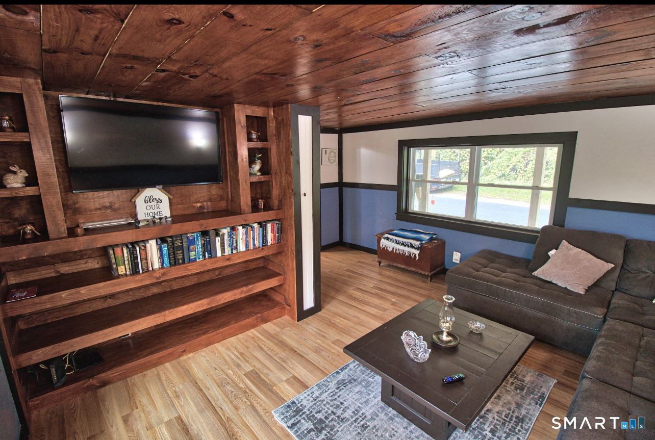 15 Lower Road North Canaan, CT 06018 - Photo 24 of 36 a living room with furniture and a flat screen tv