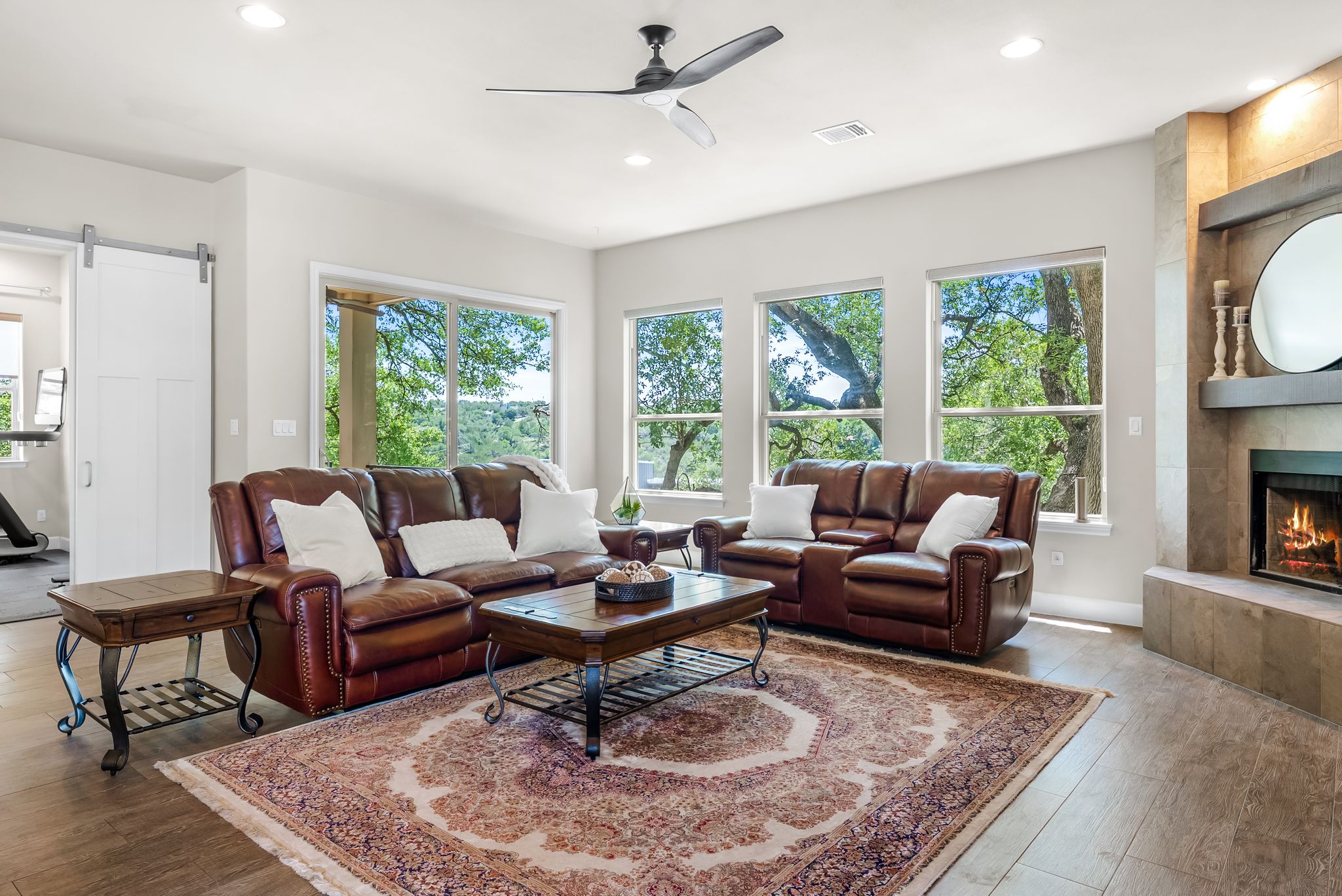 14213 Red Feather Trail Austin, TX 78734 - Photo 7 of 39 a living room with furniture fireplace and a large window