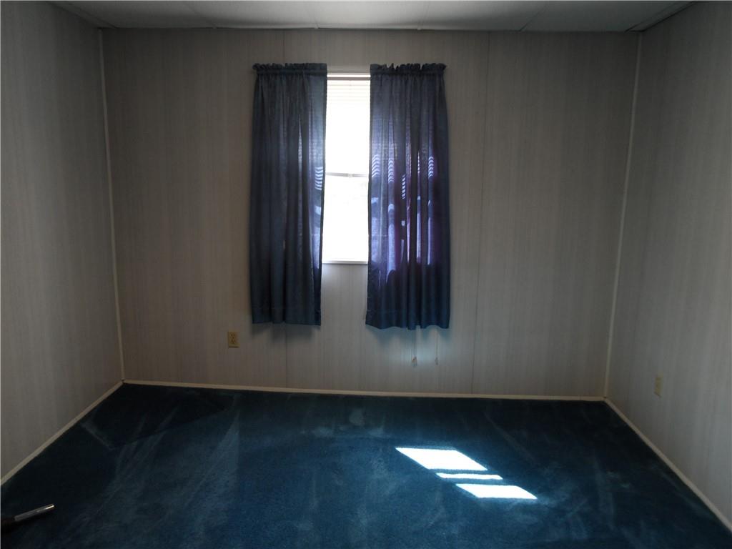130 Harrison Avenue Butler, PA 16001 - Photo 13 of 24 an empty room with wooden floor and windows