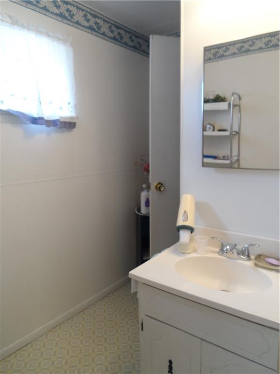 130 Harrison Avenue Butler, PA 16001 - Photo 16 of 24 a bathroom with a sink and a mirror