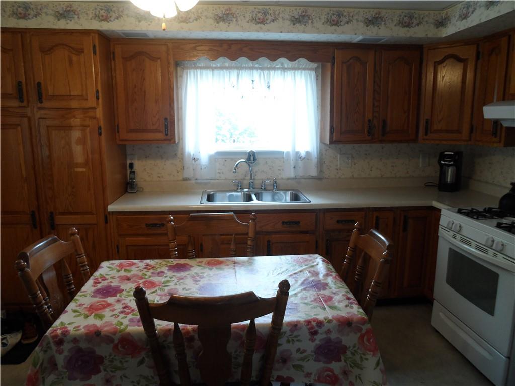 130 Harrison Avenue Butler, PA 16001 - Photo 5 of 24 a kitchen with a sink a window and cabinets