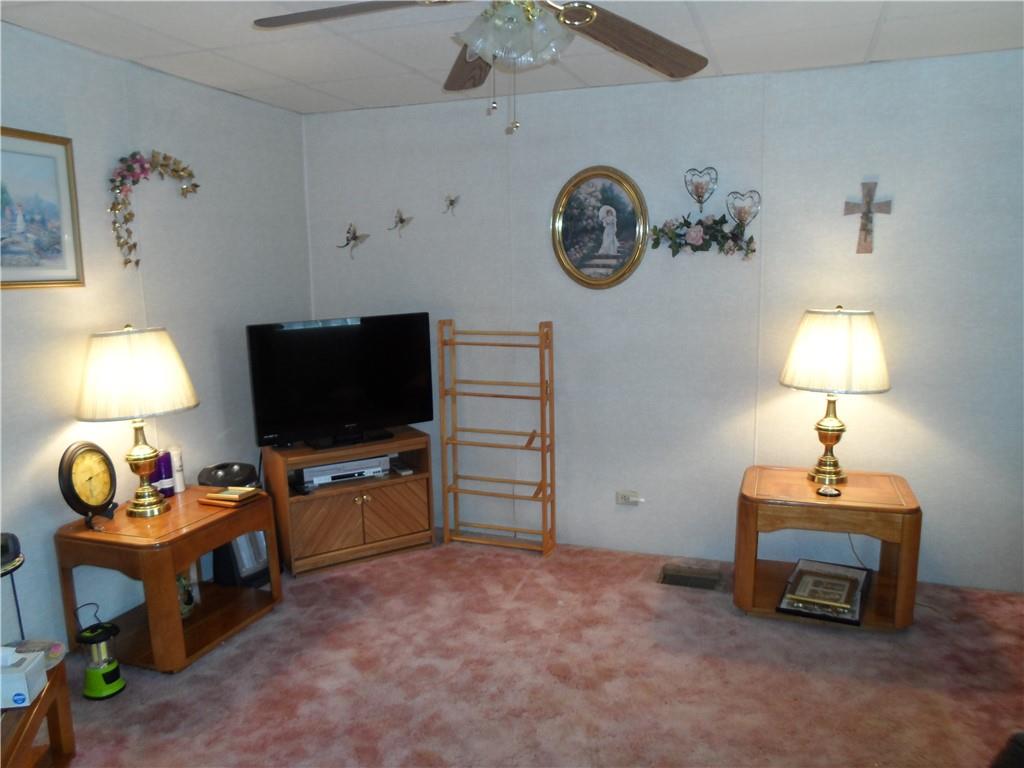 130 Harrison Avenue Butler, PA 16001 - Photo 10 of 24 a view of a livingroom with furniture and a flat screen tv