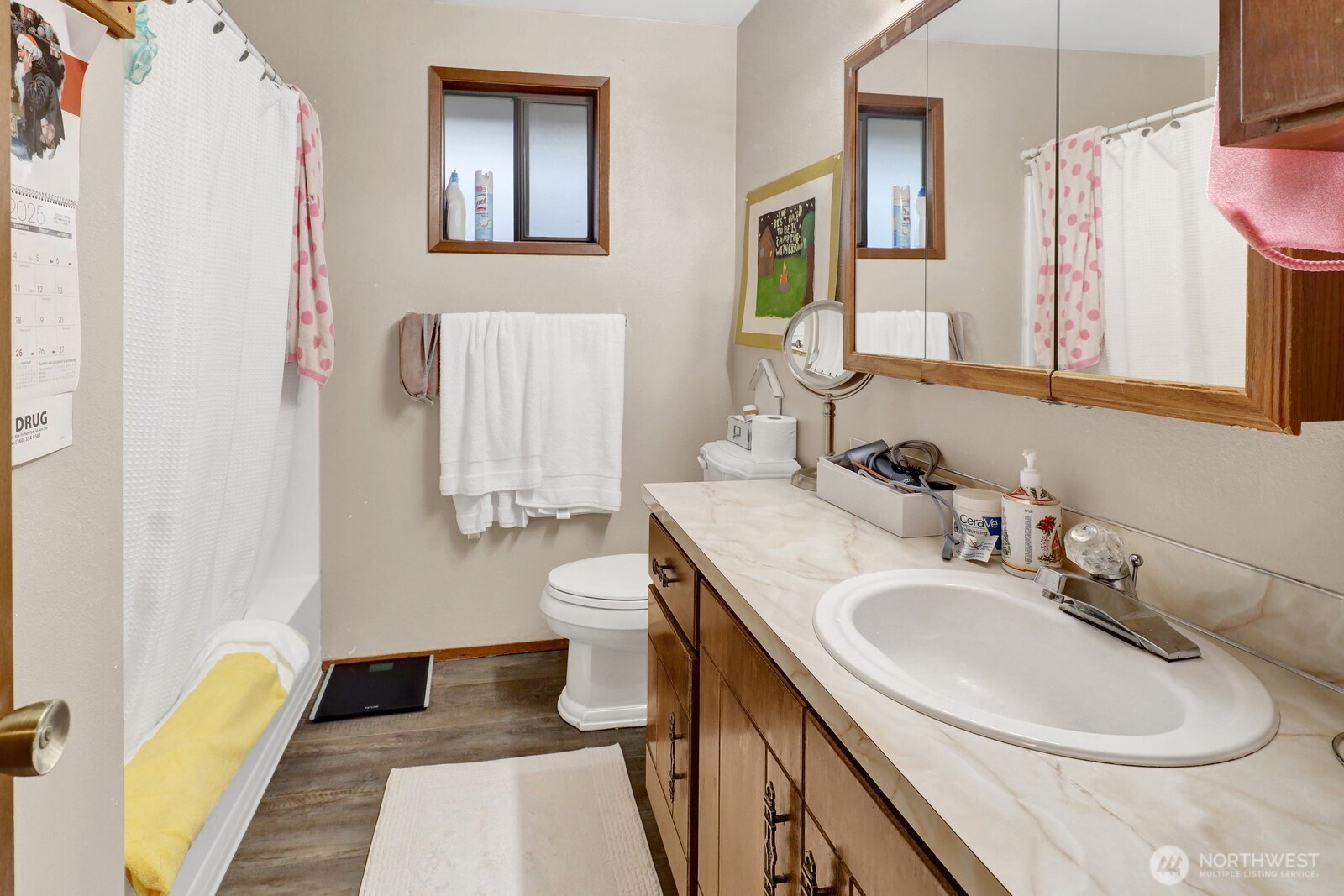 908 Liberty Street Lynden, WA 98264 - Photo 15 of 27 a bathroom with a sink toilet and mirror