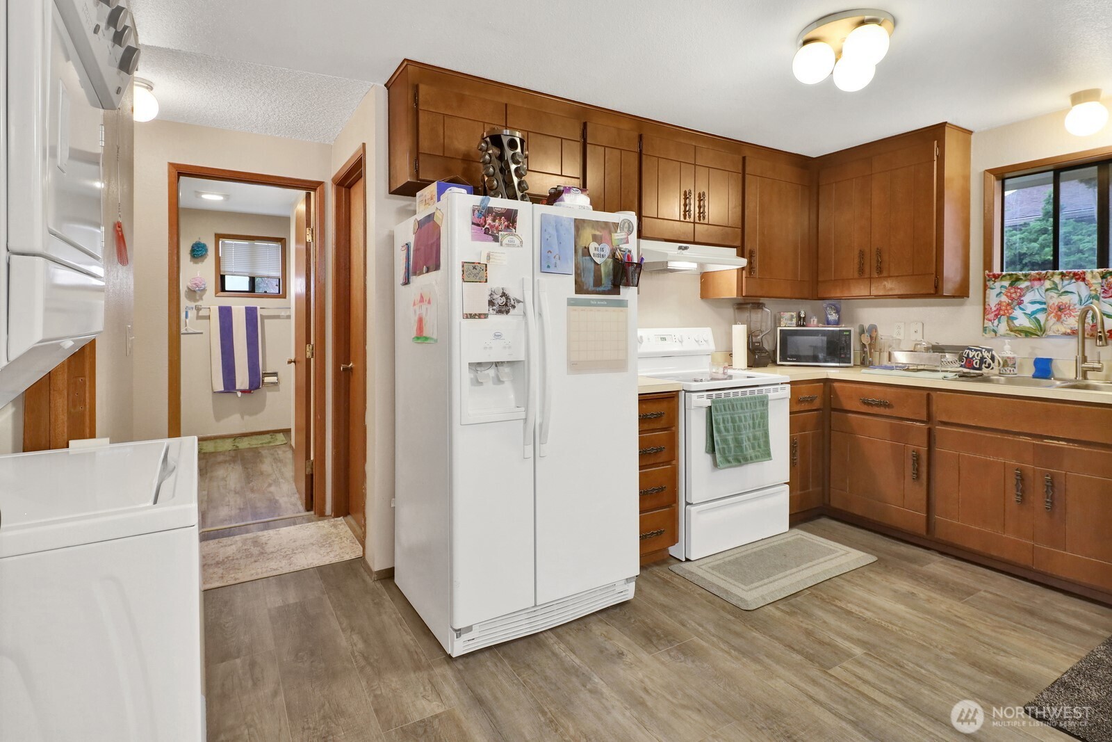 908 Liberty Street Lynden, WA 98264 - Photo 23 of 27 a kitchen with stainless steel appliances a refrigerator sink and cabinets
