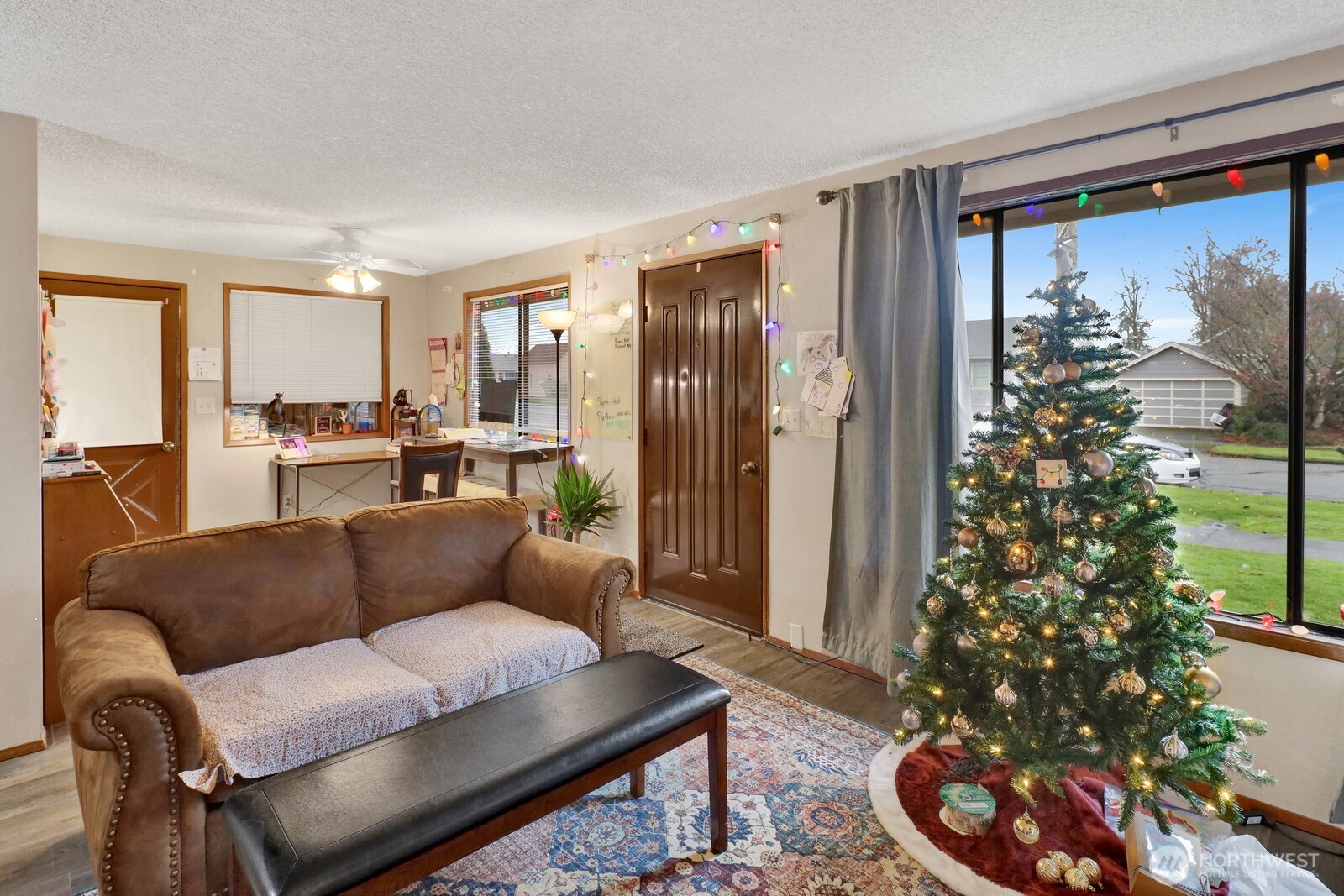 908 Liberty Street Lynden, WA 98264 - Photo 8 of 27 a living room with furniture and a potted plant