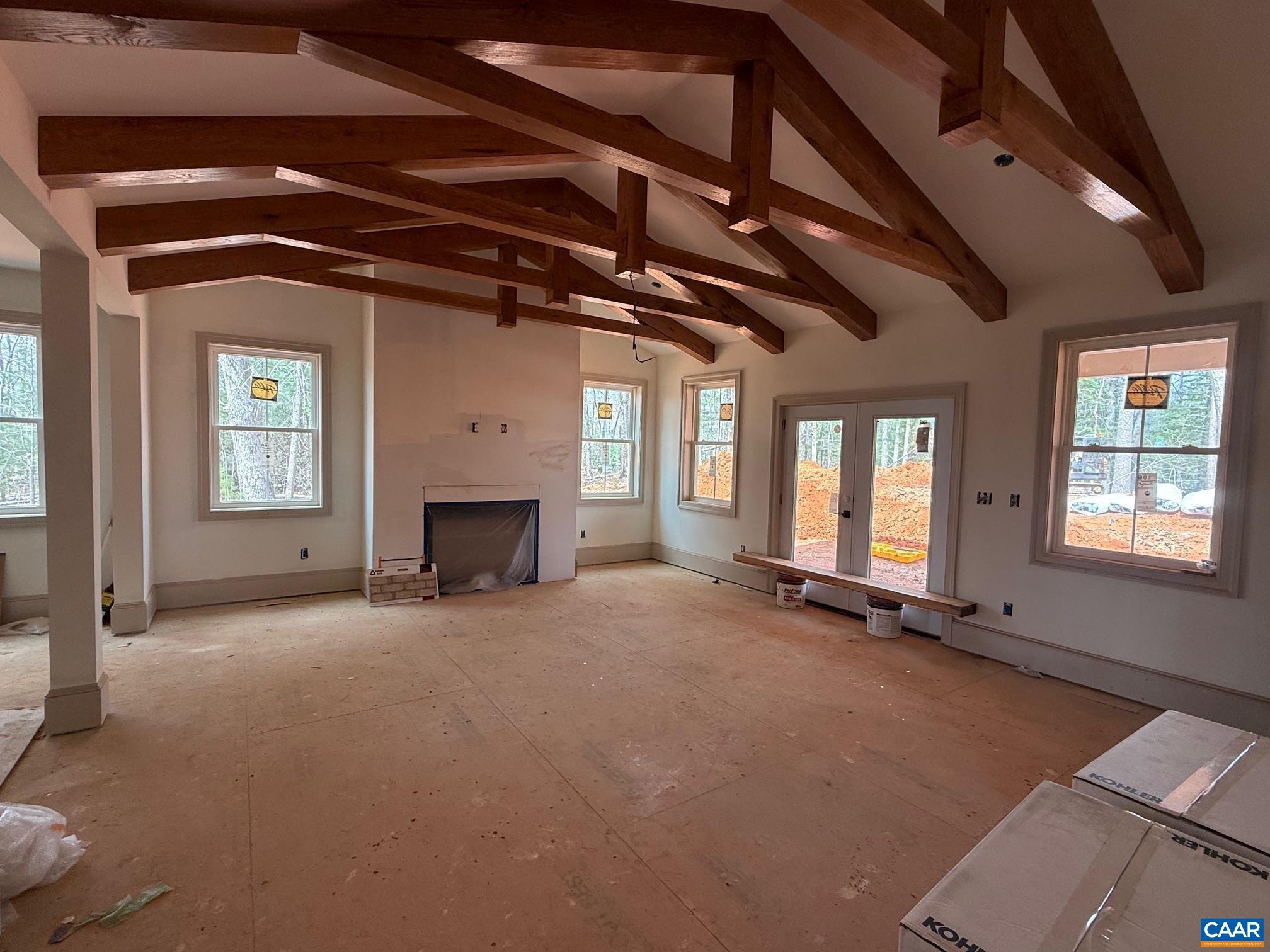 4360 Garth Road Crozet, VA 22932 - Photo 25 of 52 a view of an empty room with a fireplace and a window