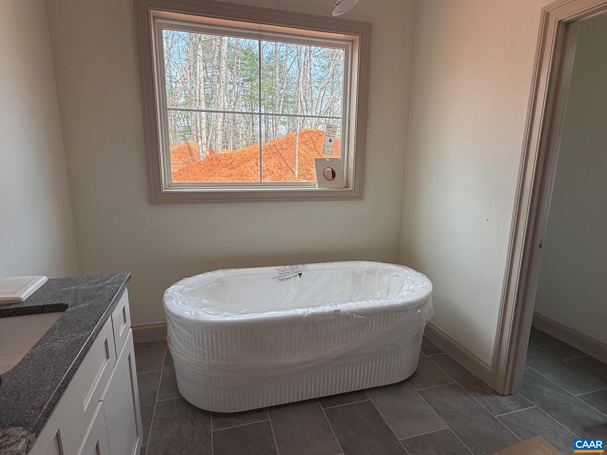 4360 Garth Road Crozet, VA 22932 - Photo 32 of 52 a white bath tub sitting in a bathroom