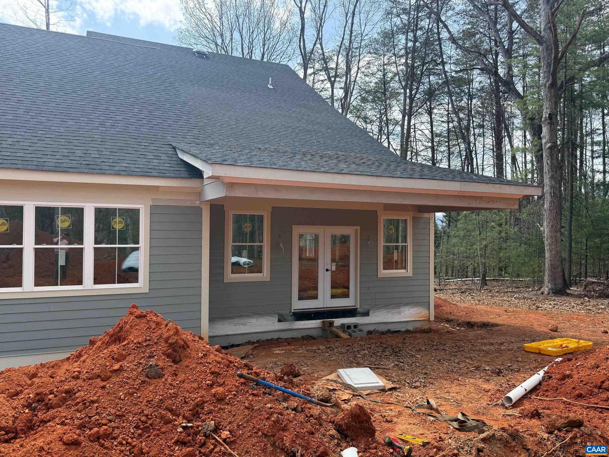 4360 Garth Road Crozet, VA 22932 - Photo 8 of 52 a backyard of a house with large tree and wooden fence