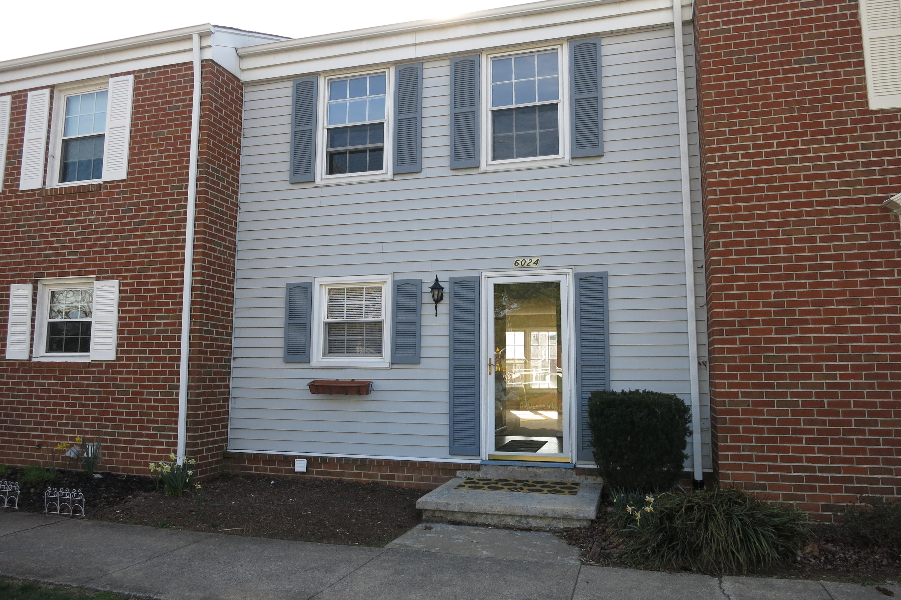 6024 Plantation Road Roanoke, VA 24019 - Photo 1 of 1 a front view of a house with a yard