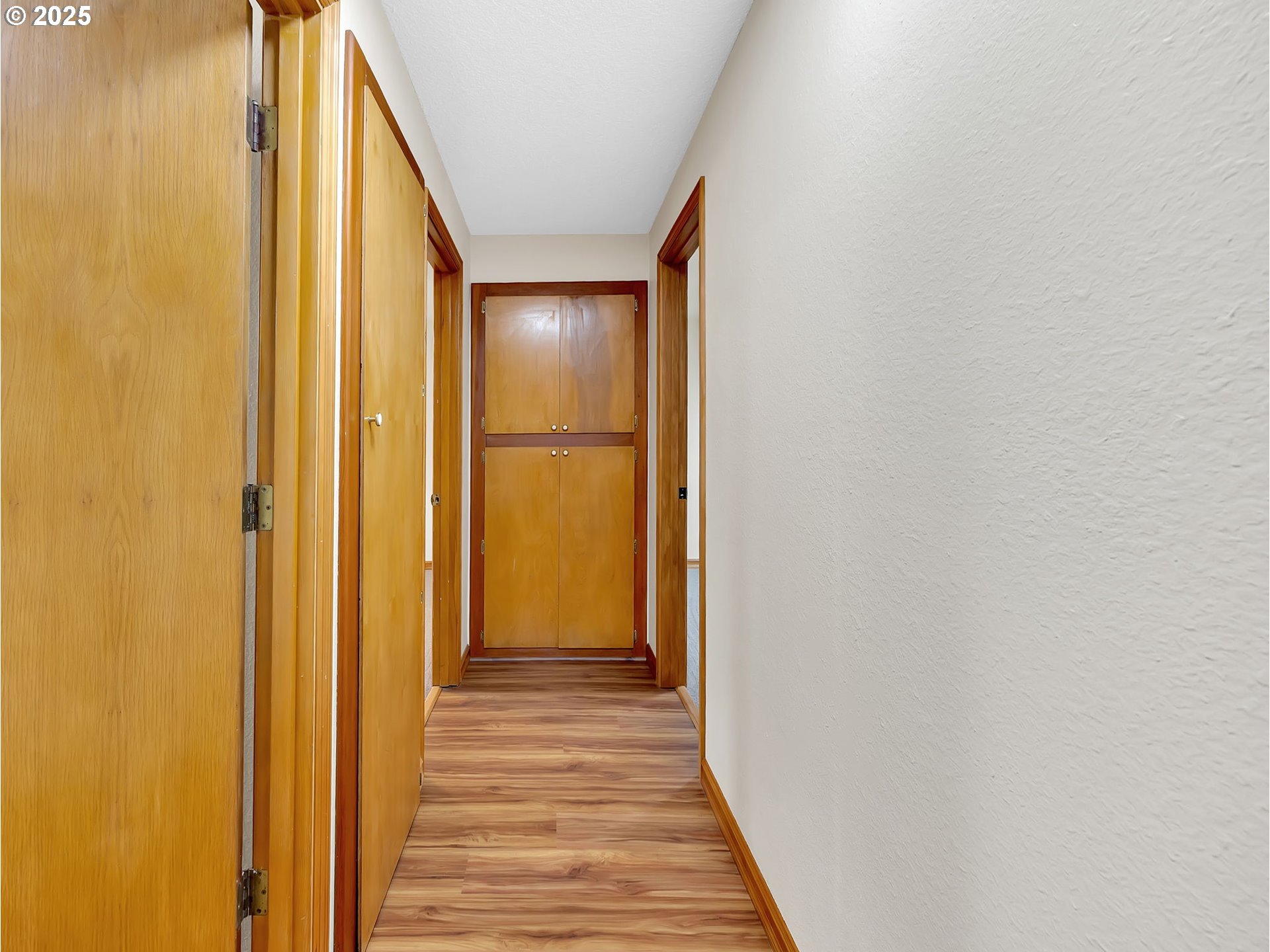 821 Southwest 14th Street Troutdale, OR 97060 - Photo 13 of 27 a view of a hallway with wooden floor
