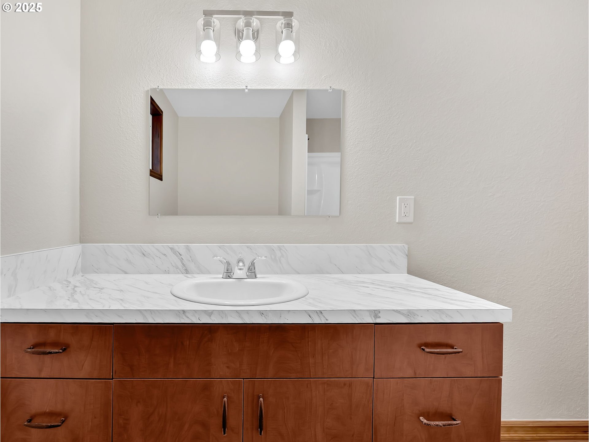 821 Southwest 14th Street Troutdale, OR 97060 - Photo 14 of 27 a bathroom with a sink and a mirror