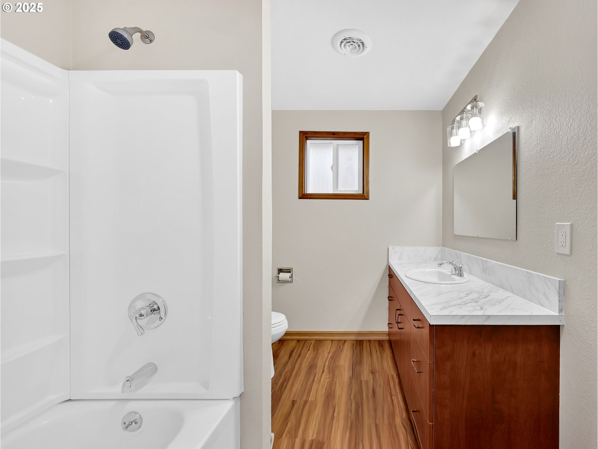 821 Southwest 14th Street Troutdale, OR 97060 - Photo 15 of 27 a bathroom with a sink a mirror and a bathtub
