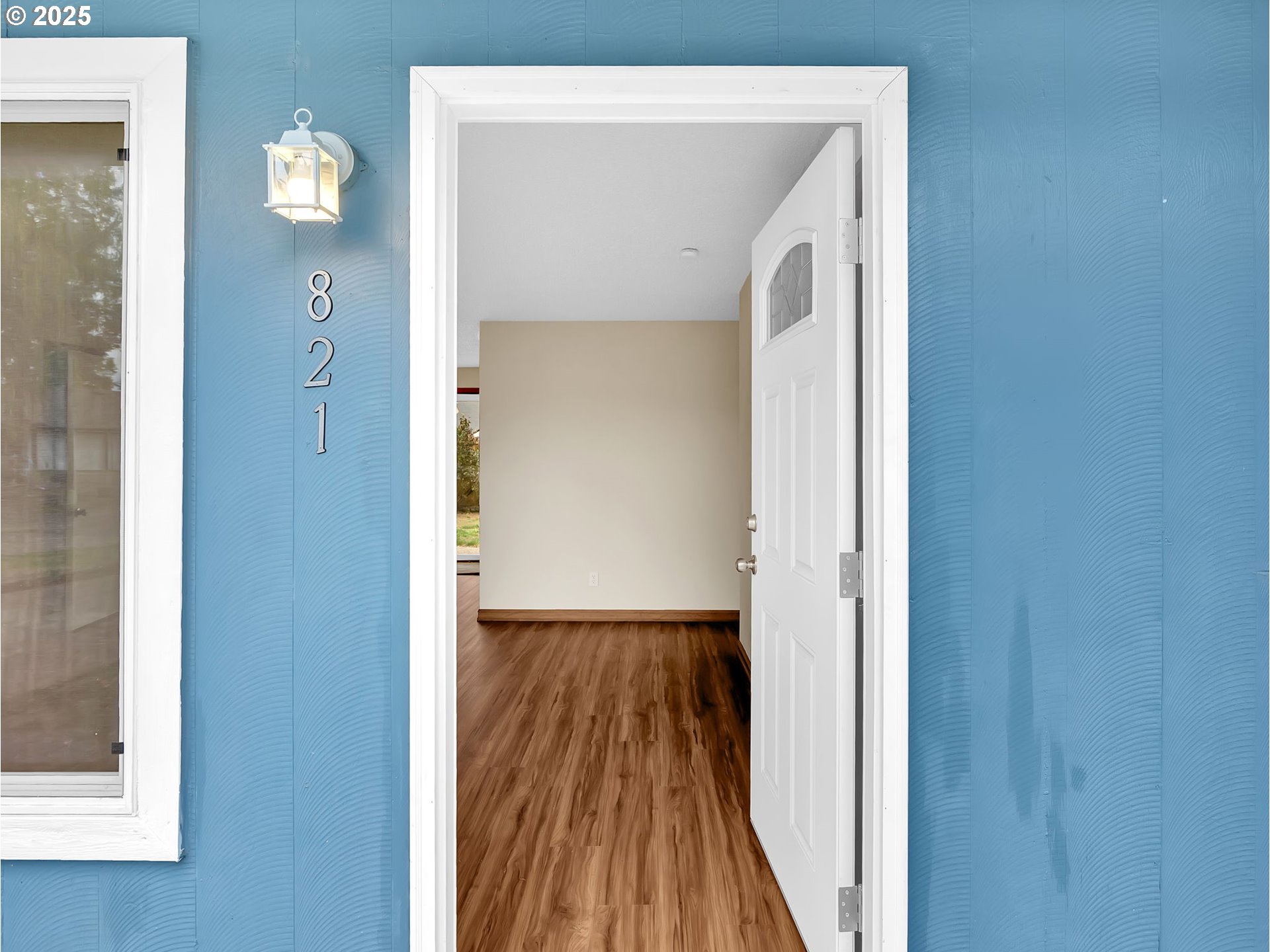 821 Southwest 14th Street Troutdale, OR 97060 - Photo 5 of 27 a view of a hallway with wooden floor and entryway
