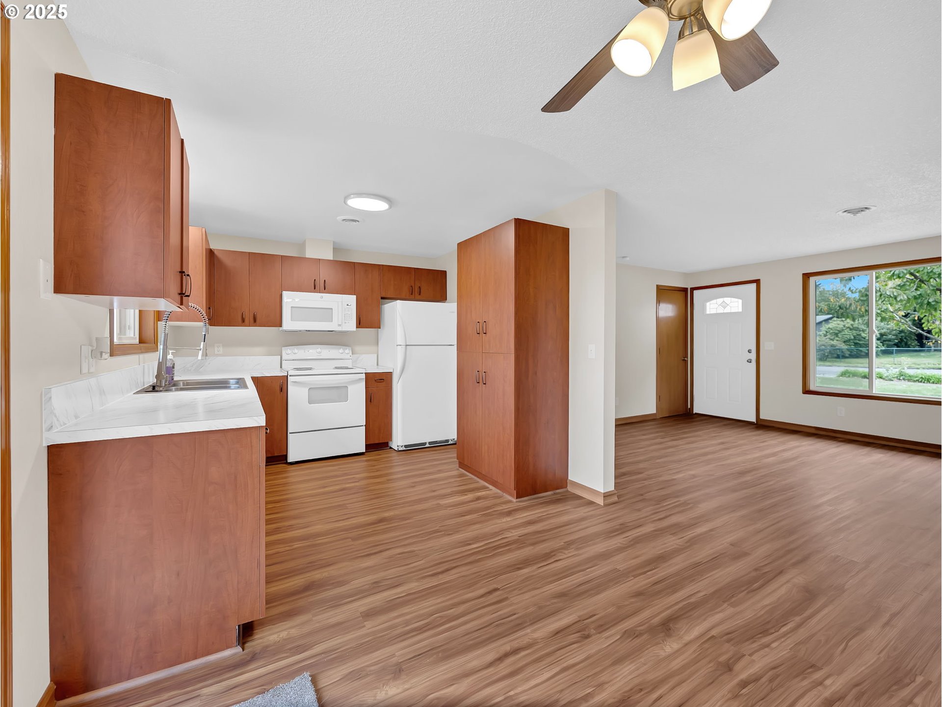 821 Southwest 14th Street Troutdale, OR 97060 - Photo 9 of 27 a view of kitchen with stainless steel appliances granite countertop cabinets and wooden floor