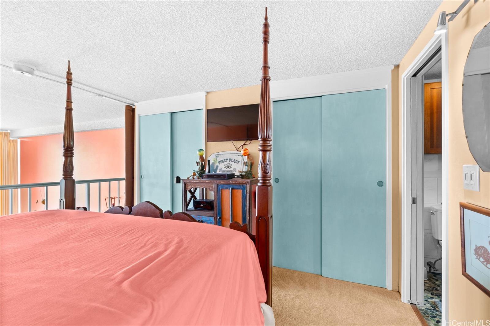 666 Prospect Street, Unit I405 Honolulu, HI 96813 - Photo 12 of 21 a bed room with a bed and a flat tv screen