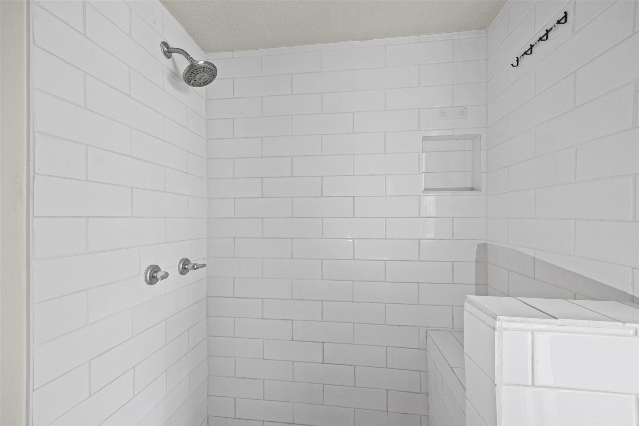 1531 Lahn Road New Braunfels, TX 78130 - Photo 9 of 33 Crisp subway tile surrounds this shower enclosure featuring built-in shelving.