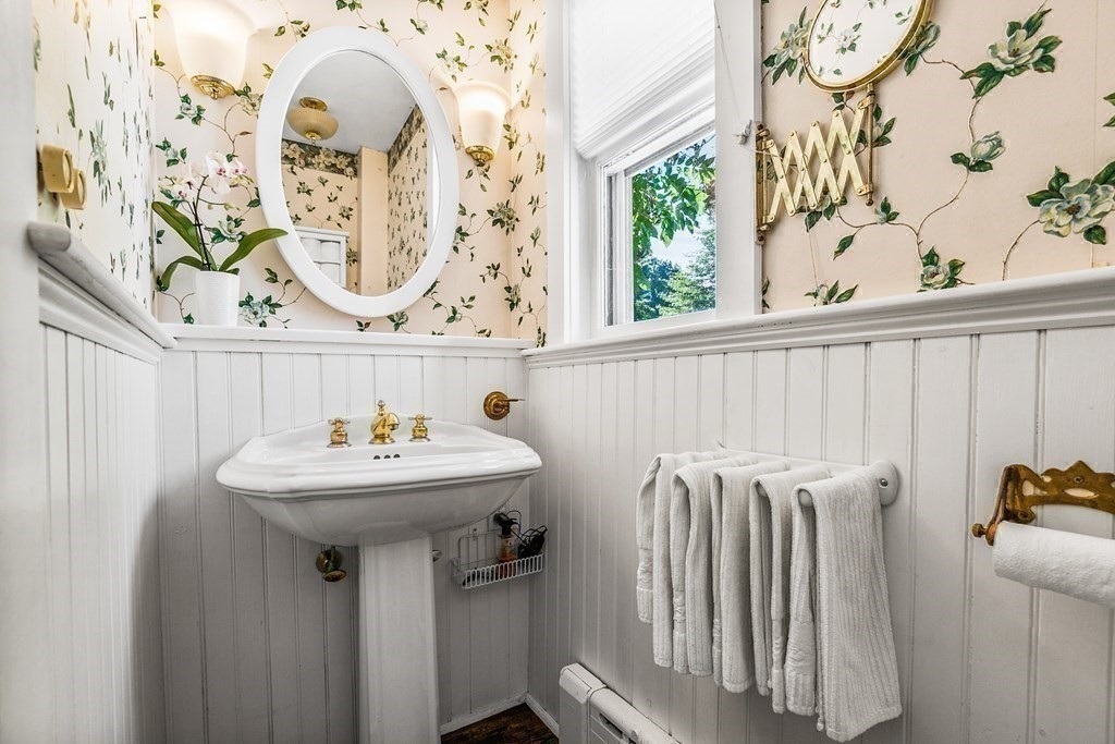 216 Spring Street Marshfield, MA 02050 - Photo 12 of 36 a bathroom with a sink and mirror with window