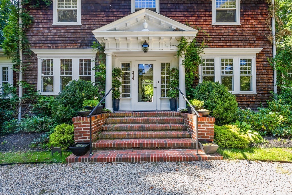 216 Spring Street Marshfield, MA 02050 - Photo 2 of 36 a front view of a house with a yard