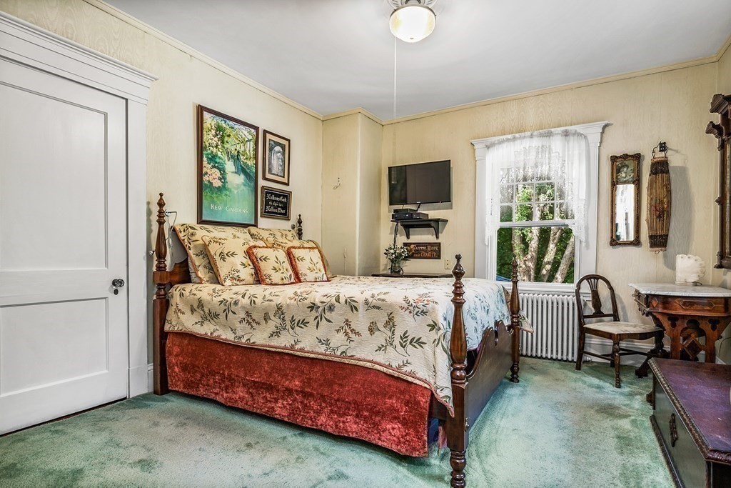 216 Spring Street Marshfield, MA 02050 - Photo 22 of 36 a bedroom with a bed and a couch