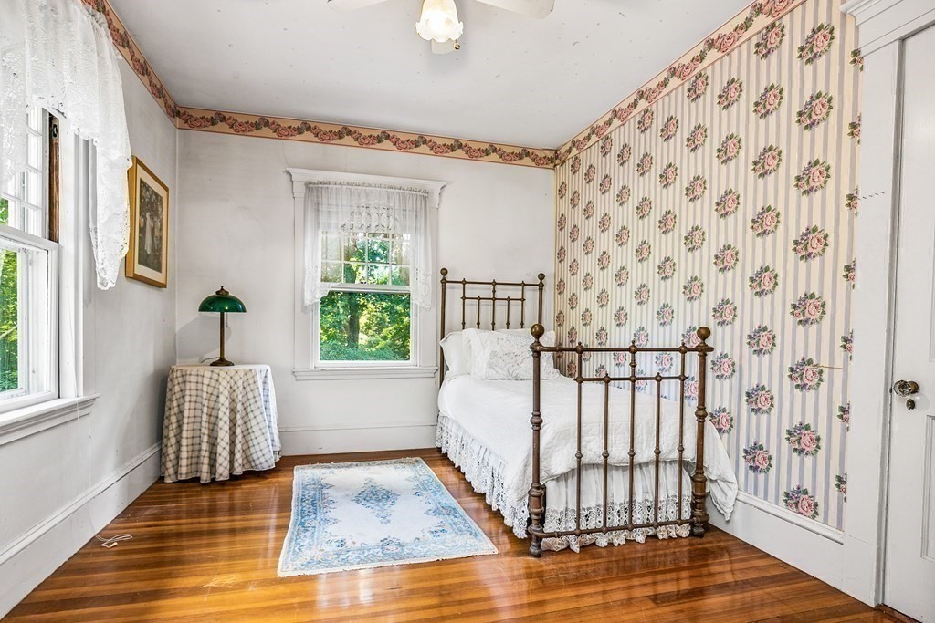 216 Spring Street Marshfield, MA 02050 - Photo 23 of 36 a bedroom with a bed and a window