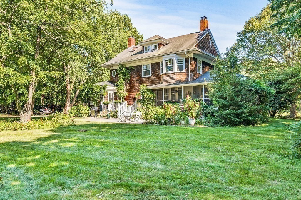 216 Spring Street Marshfield, MA 02050 - Photo 27 of 36 a front view of a house with a garden