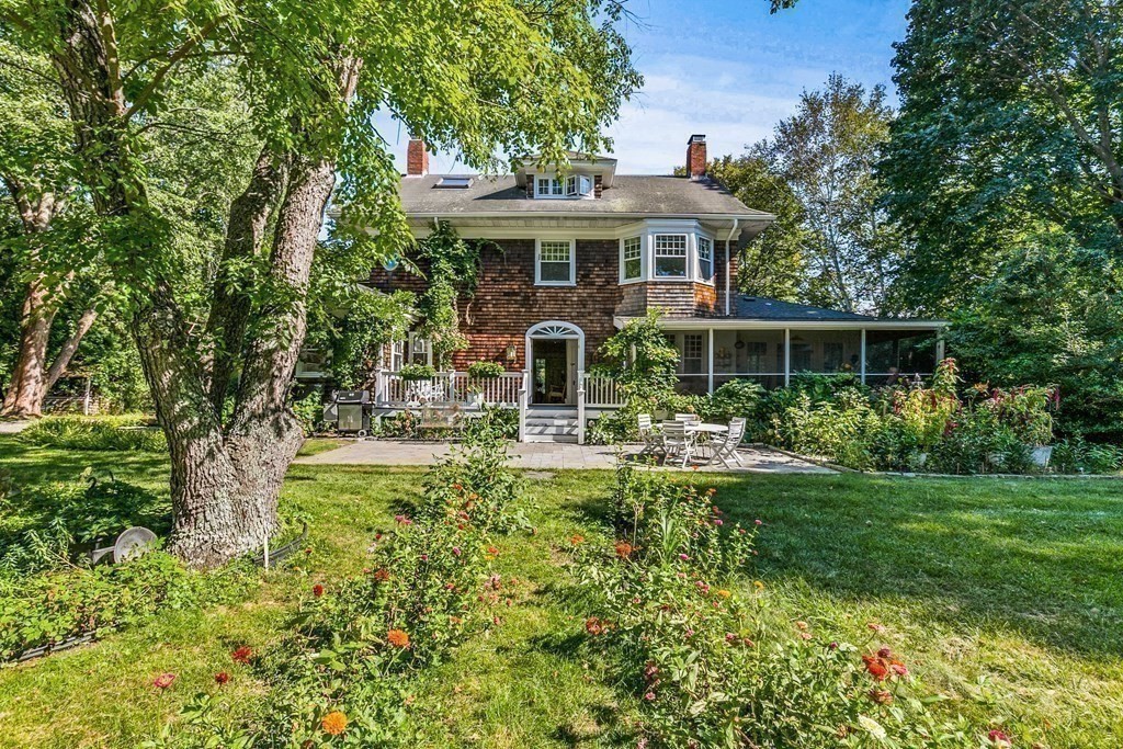 216 Spring Street Marshfield, MA 02050 - Photo 29 of 36 a front view of a house with swimming pool having outdoor seating