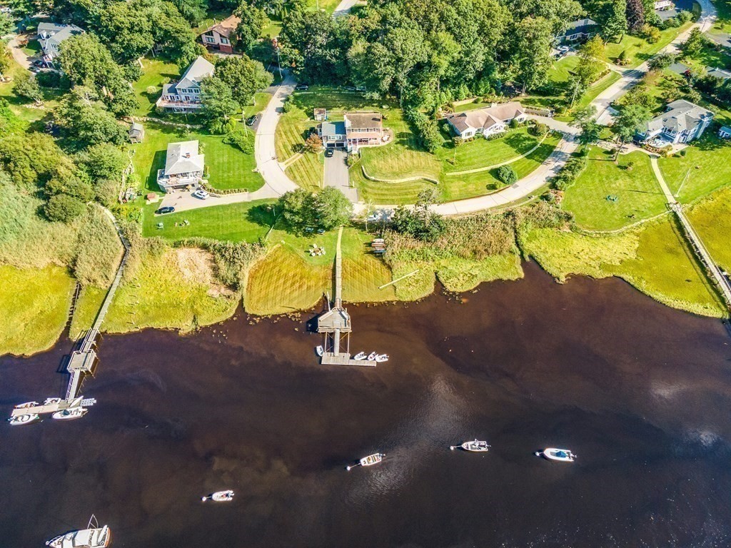 216 Spring Street Marshfield, MA 02050 - Photo 35 of 36 a picture of a building with a yard